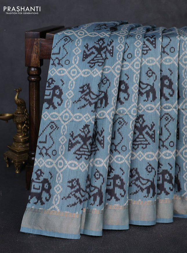 Munga tussar silk saree pastel blue with allover patola prints and zari woven border