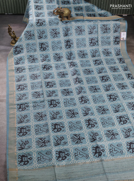 Munga tussar silk saree pastel blue with allover patola prints and zari woven border