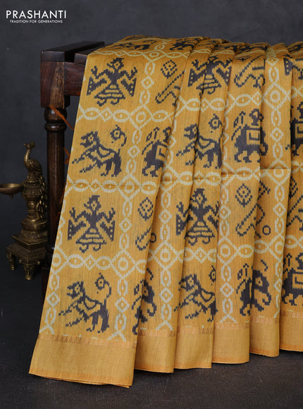 Munga tussar silk saree mustard yellow with allover patola prints and zari woven border