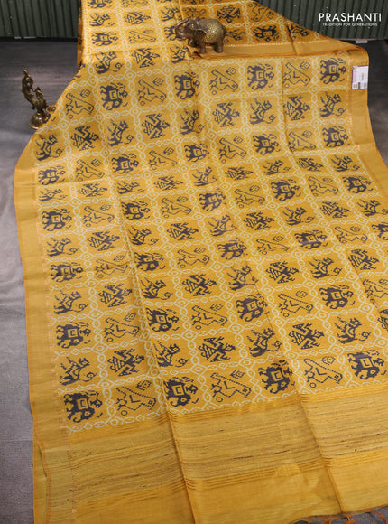 Munga tussar silk saree mustard yellow with allover patola prints and zari woven border