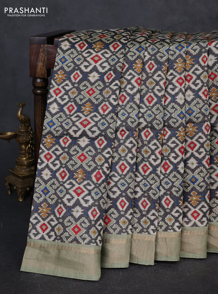 Munga tussar silk saree grey and pastel green with allover ikat prints and zari woven border