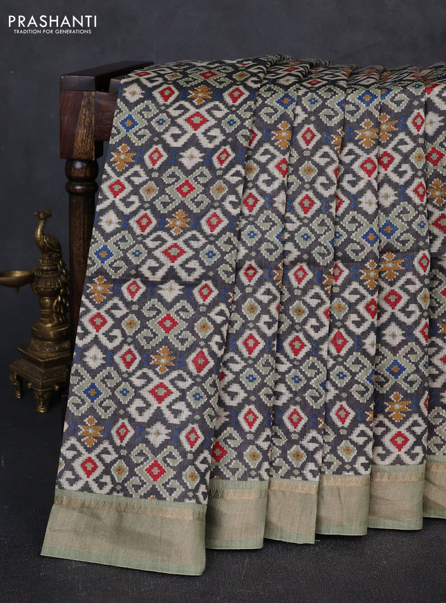 Munga tussar silk saree grey and pastel green with allover ikat prints and zari woven border