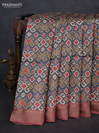 Munga tussar silk saree blue and pastel maroon with allover ikat prints and zari woven border