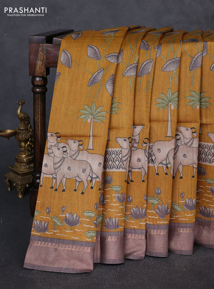 Munga tussar silk saree mustard yellow and grey with allover pichwai prints and zari woven border
