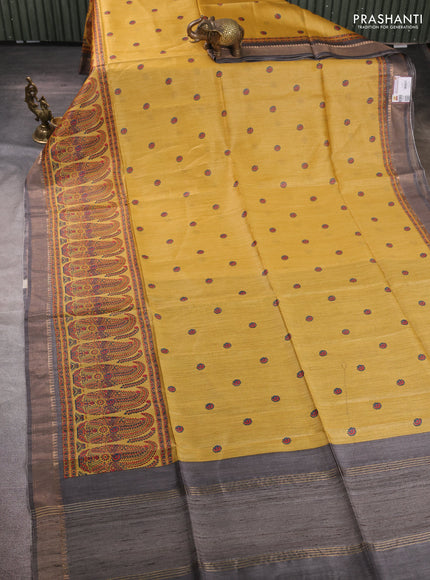 Munga tussar silk saree mustard yellow and grey with allover butta prints and zari woven border