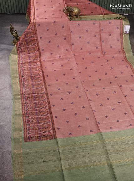 Munga tussar silk saree pastel peach and green with allover butta prints and zari woven border