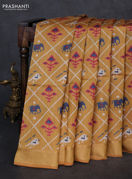 Munga tussar silk saree mustard yellow with allover patola prints and zari woven border