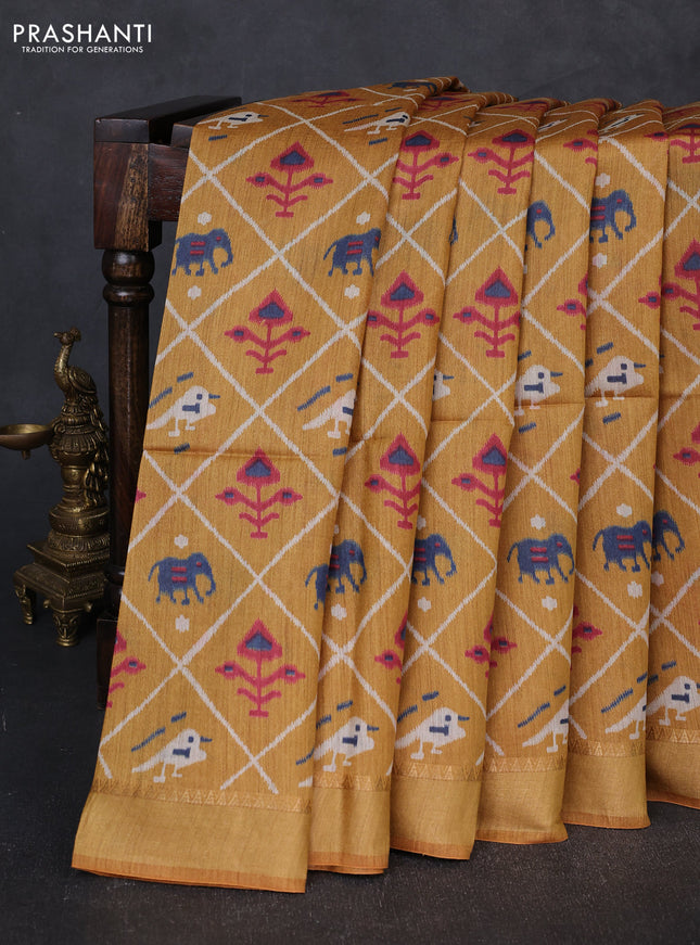 Munga tussar silk saree mustard yellow with allover patola prints and zari woven border