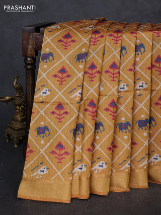 Munga tussar silk saree mustard yellow with allover patola prints and zari woven border