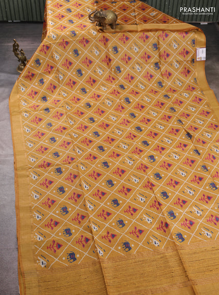Munga tussar silk saree mustard yellow with allover patola prints and zari woven border