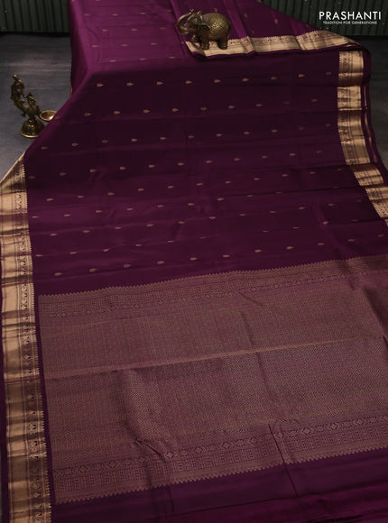 Kanchipuram silk saree wine shade with allover zari woven buttas and rich zari woven border