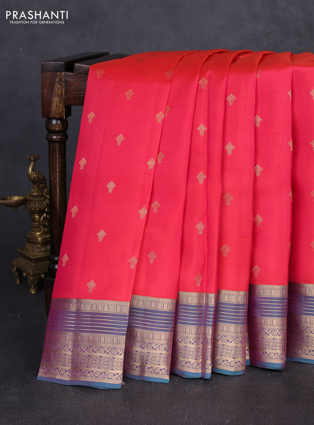 Kanchipuram silk saree tomato pink and dual shade of teal green with allover zari woven buttas and zari woven border