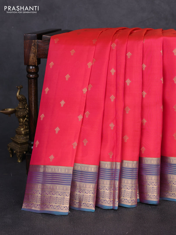 Kanchipuram silk saree tomato pink and dual shade of teal green with allover zari woven buttas and zari woven border