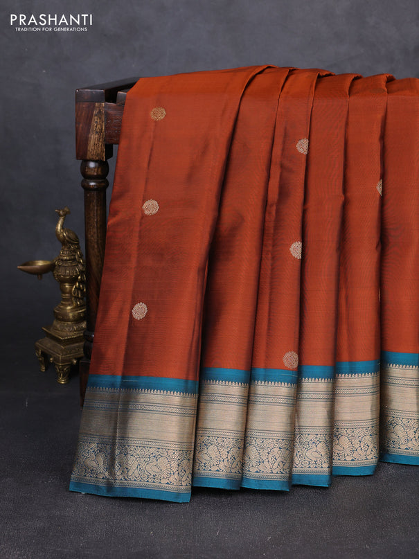 Kanchipuram silk saree rust shade and teal blue with zari woven buttas and zari woven border