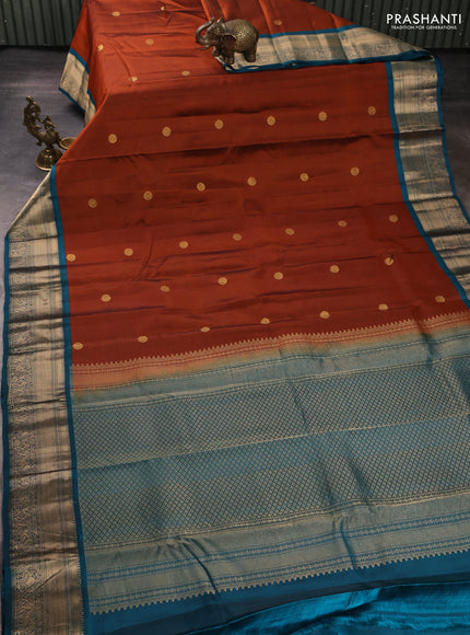 Kanchipuram silk saree rust shade and teal blue with zari woven buttas and zari woven border