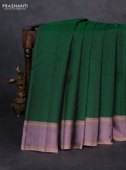 Kanchipuram silk saree green and pastel purple with allover zari weaves and rettapet zari woven border