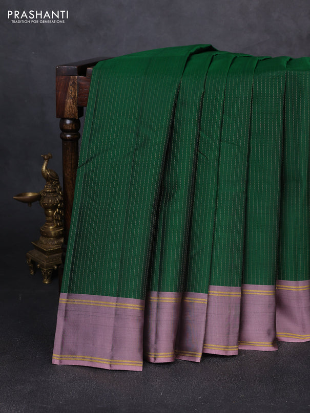 Kanchipuram silk saree green and pastel purple with allover zari weaves and rettapet zari woven border