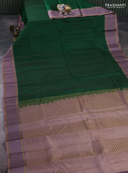 Kanchipuram silk saree green and pastel purple with allover zari weaves and rettapet zari woven border