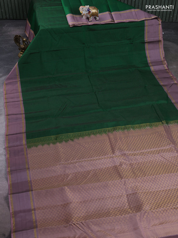Kanchipuram silk saree green and pastel purple with allover zari weaves and rettapet zari woven border