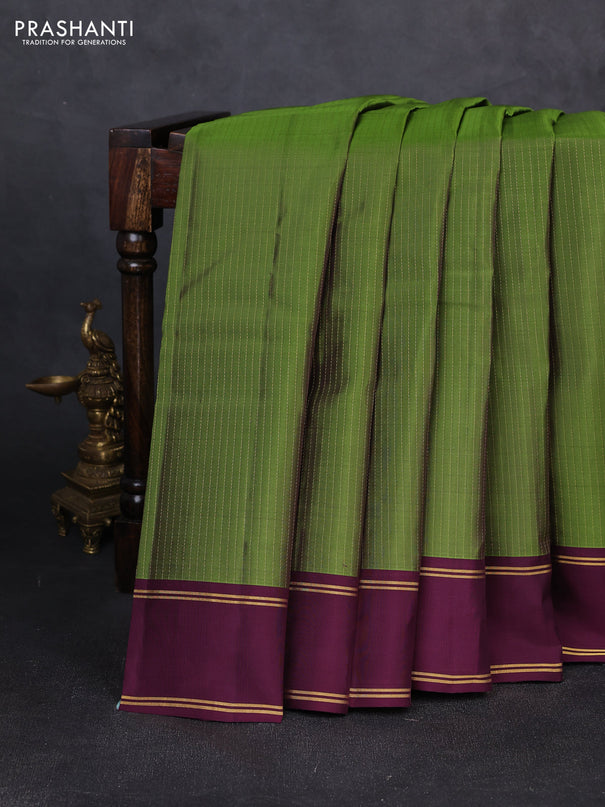 Kanchipuram silk saree light green and wine shade with allover zari weaves and rettapet zari woven border