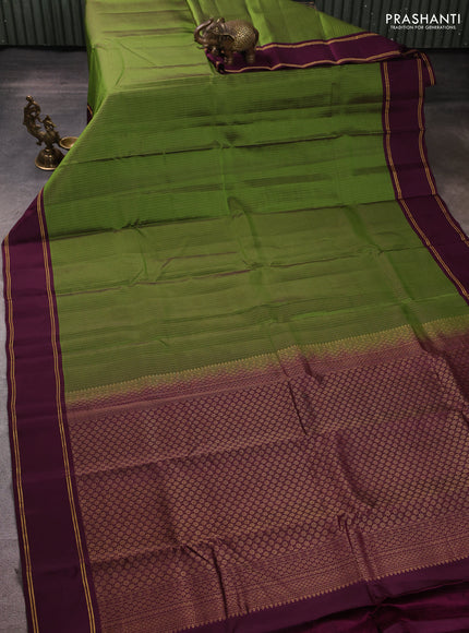 Kanchipuram silk saree light green and wine shade with allover zari weaves and rettapet zari woven border