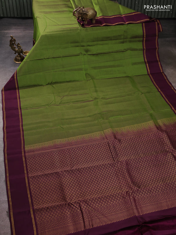 Kanchipuram silk saree light green and wine shade with allover zari weaves and rettapet zari woven border