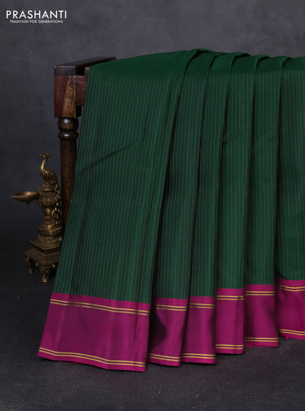 Kanchipuram silk saree bottle green and magenta pink with allover zari weaves and rettapet zari woven border