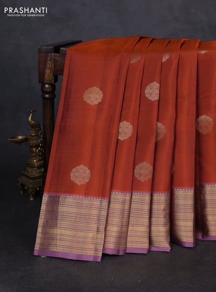 Kanchipuram silk saree rust shade and pastel purple with zari woven buttas and zari woven border
