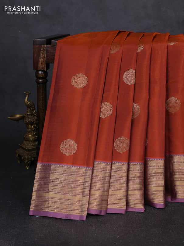 Kanchipuram silk saree rust shade and pastel purple with zari woven buttas and zari woven border
