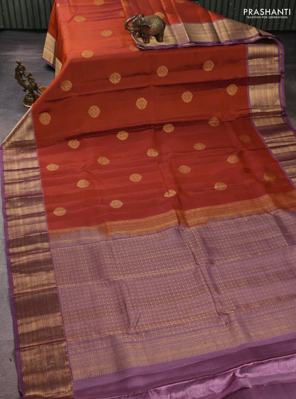 Kanchipuram silk saree rust shade and pastel purple with zari woven buttas and zari woven border