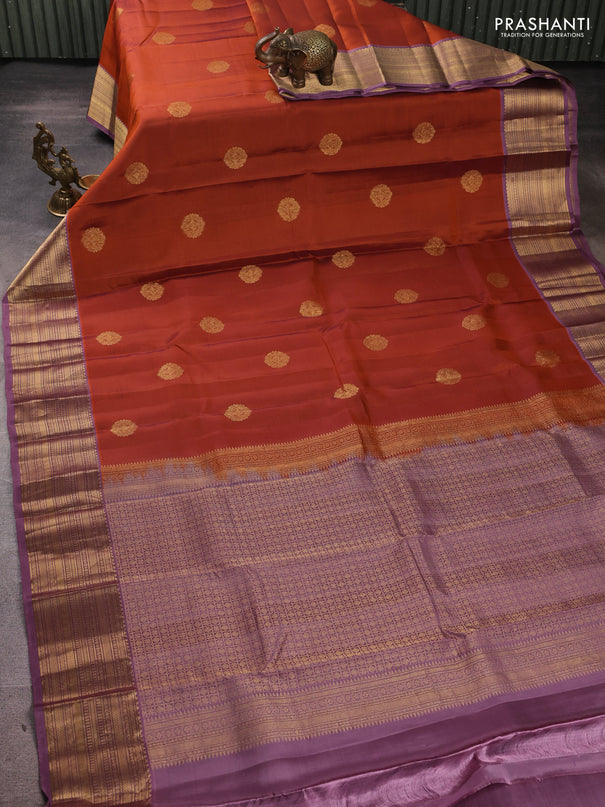 Kanchipuram silk saree rust shade and pastel purple with zari woven buttas and zari woven border