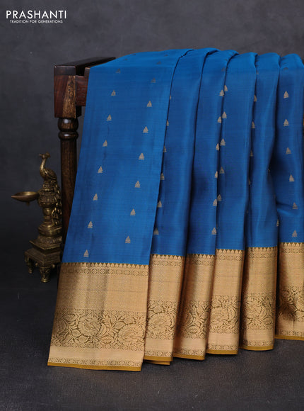 Kanchipuram silk saree cs blue and mustard green with allover zari woven buttas and rich zari woven border
