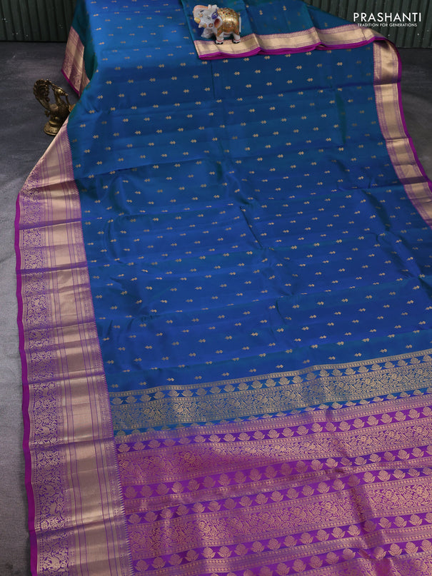 Kanchipuram silk saree peacock blue and magenta pink with allover zari woven buttas and long rich zari woven border