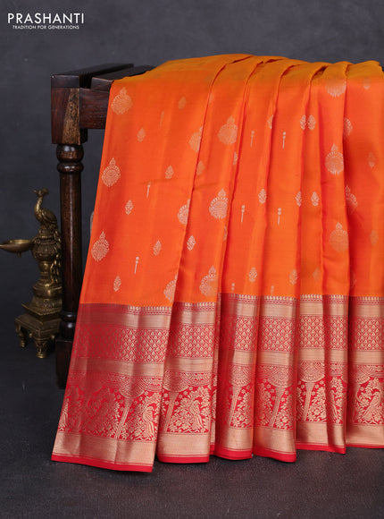 Kanchipuram silk saree orange and red with allover zari woven buttas and long zari woven border