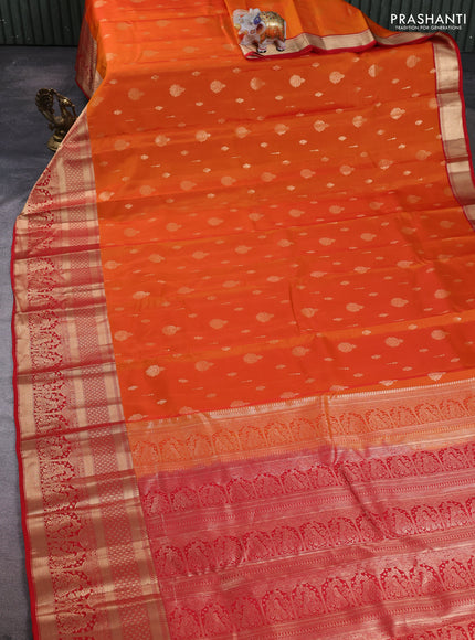 Kanchipuram silk saree orange and red with allover zari woven buttas and long zari woven border