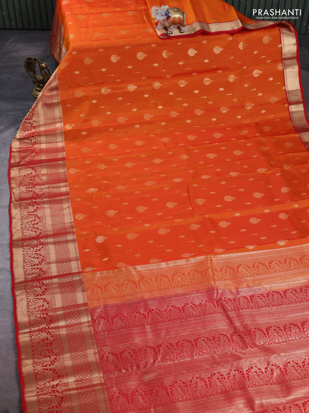 Kanchipuram silk saree orange and red with allover zari woven buttas and long zari woven border