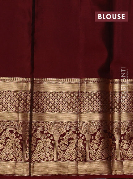Kanchipuram silk saree green and maroon with allover zari woven buttas and long zari woven border