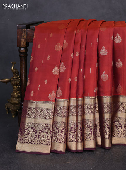Kanchipuram silk saree rust shade and coffee brown with allover zari woven buttas and long zari woven border