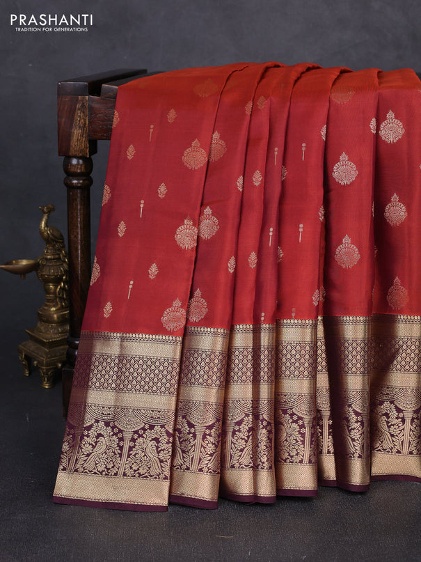 Kanchipuram silk saree rust shade and coffee brown with allover zari woven buttas and long zari woven border