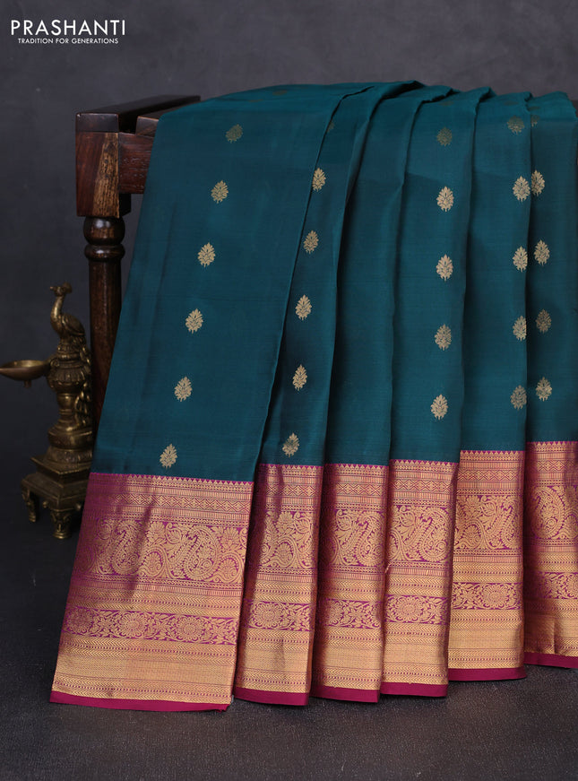 Kanchipuram silk saree peacock green and magenta pink with allover zari woven buttas and long zari woven border