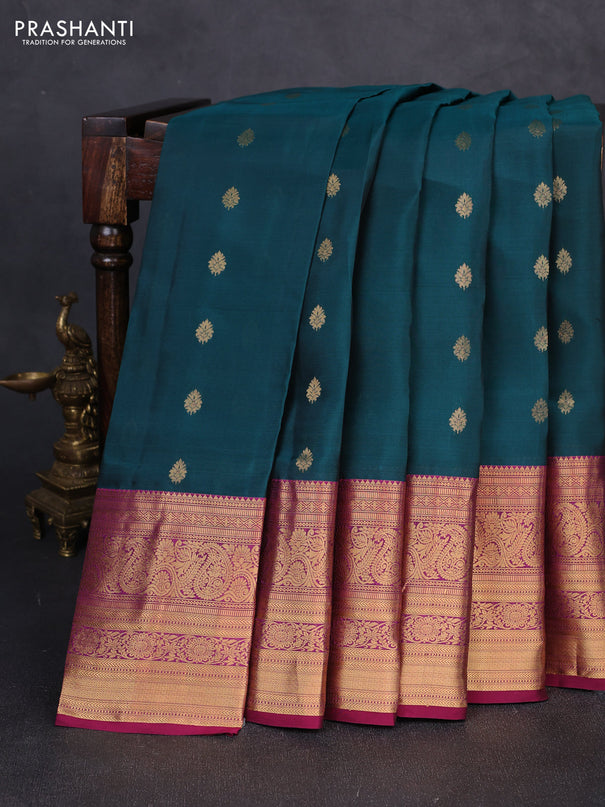 Kanchipuram silk saree peacock green and magenta pink with allover zari woven buttas and long zari woven border