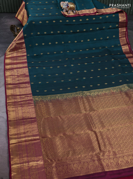 Kanchipuram silk saree peacock green and magenta pink with allover zari woven buttas and long zari woven border