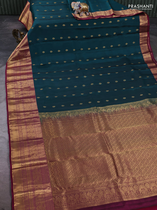 Kanchipuram silk saree peacock green and magenta pink with allover zari woven buttas and long zari woven border