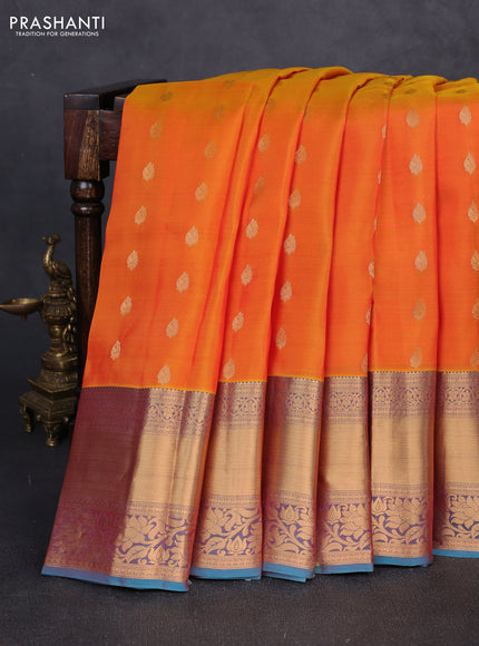 Kanchipuram silk saree sunset orange and dual shade of pinkish teal blue with allover zari woven buttas and long rich zari woven border