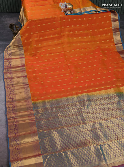 Kanchipuram silk saree sunset orange and dual shade of pinkish teal blue with allover zari woven buttas and long rich zari woven border