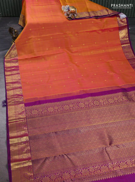 Pure kanchipuram silk saree dual shade of pinkish orange and purple with zari woven buttas and paisley zari woven border