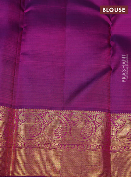 Pure kanchipuram silk saree dual shade of pinkish orange and purple with zari woven buttas and paisley zari woven border