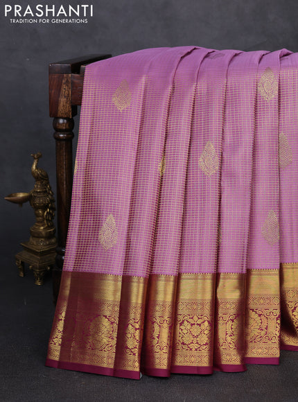 Pure kanchipuram silk saree pastel purple and wine shade with allover small zari checks & buttas and rich zari woven border