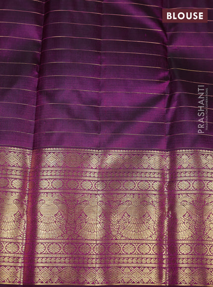 Pure kanchipuram silk saree wine shade with allover zari checks & buttas and long zari woven border