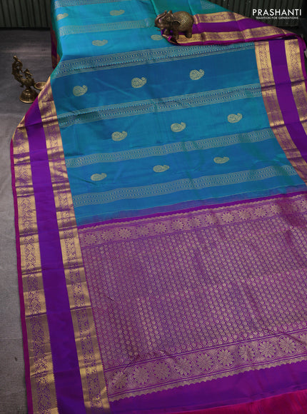 Pure kanchipuram silk saree dual shade of bluish green and purple with zari woven buttas and rettapet zari woven border